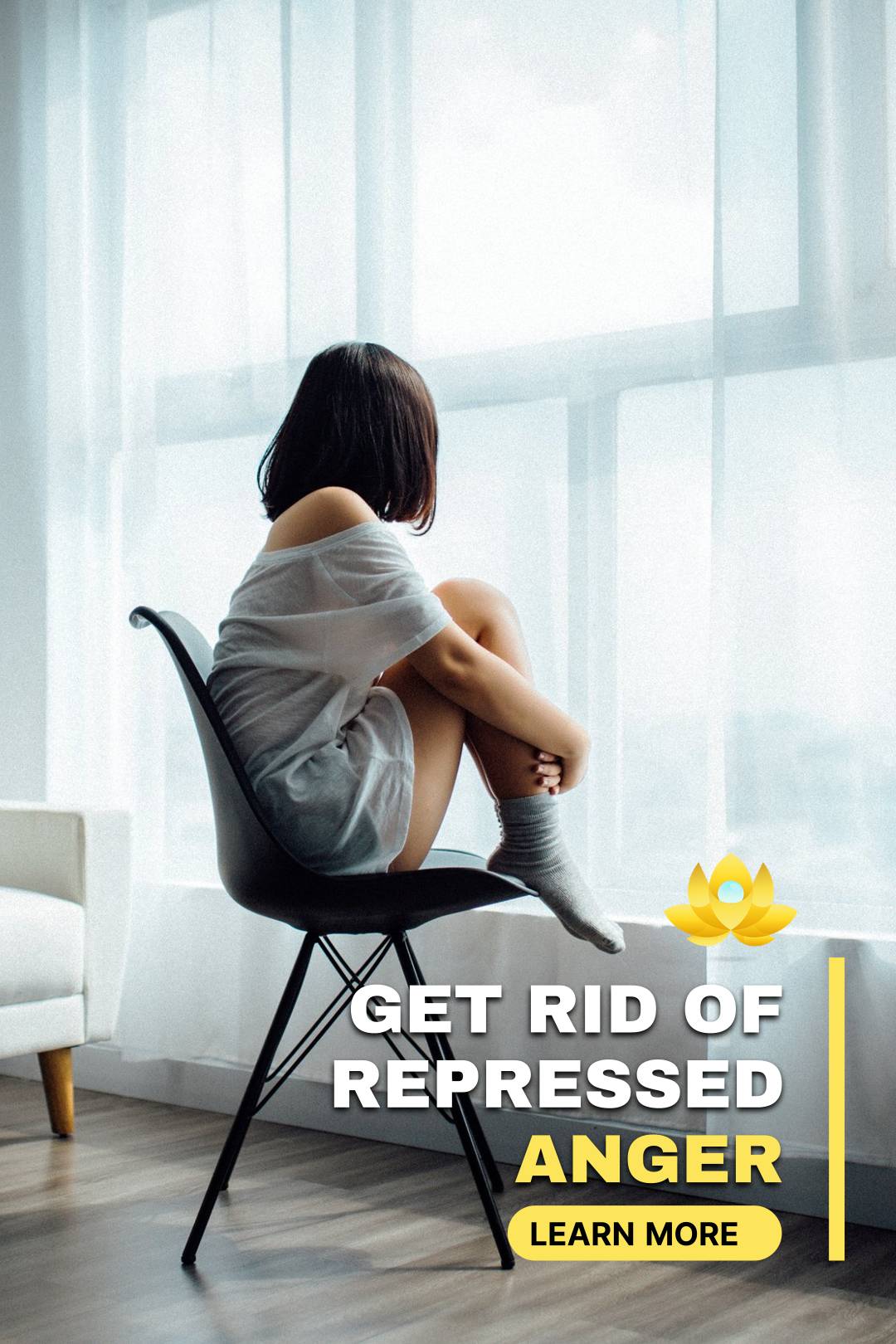 Girl sitting on the stool in front of the window and hugging her legs